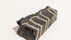 Oblique view - the enamel bands run through the full thickness of the piece